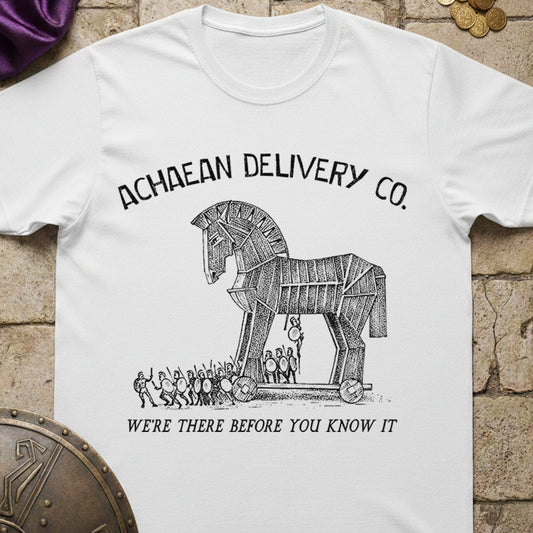 White t-shirt with Trojan horse graphic and text on a stone surface