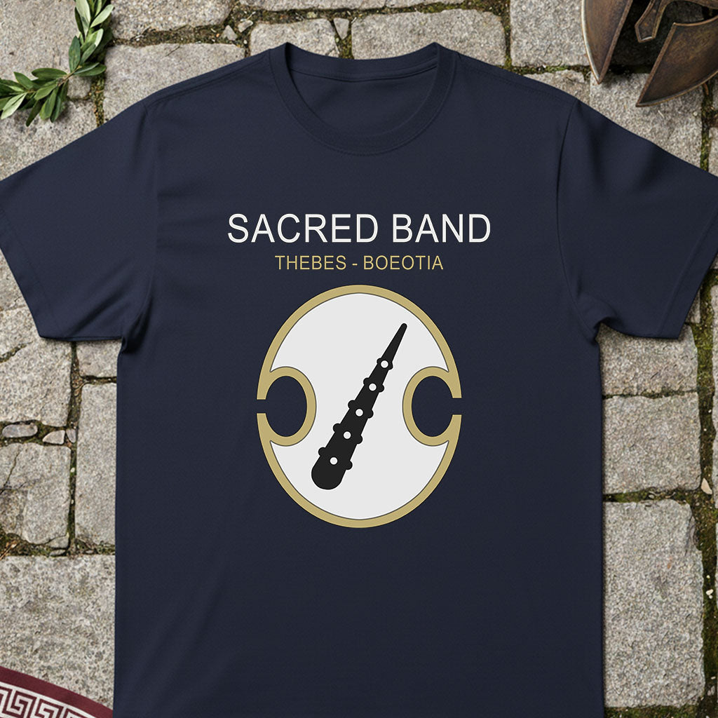 Navy blue t-shirt with 'Sacred Band Thebes Boeotia' design on a stone surface