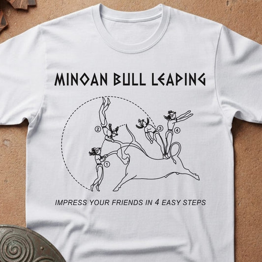 A white short-sleeve crewneck t-shirt laid flat on a textured brown surface. The shirt features a black graphic print of a Minoan bull with the text 'MINOAN BULL LEADING' above and 'IMPRESS YOUR FRIENDS IN 4 EASY STEPS' below.