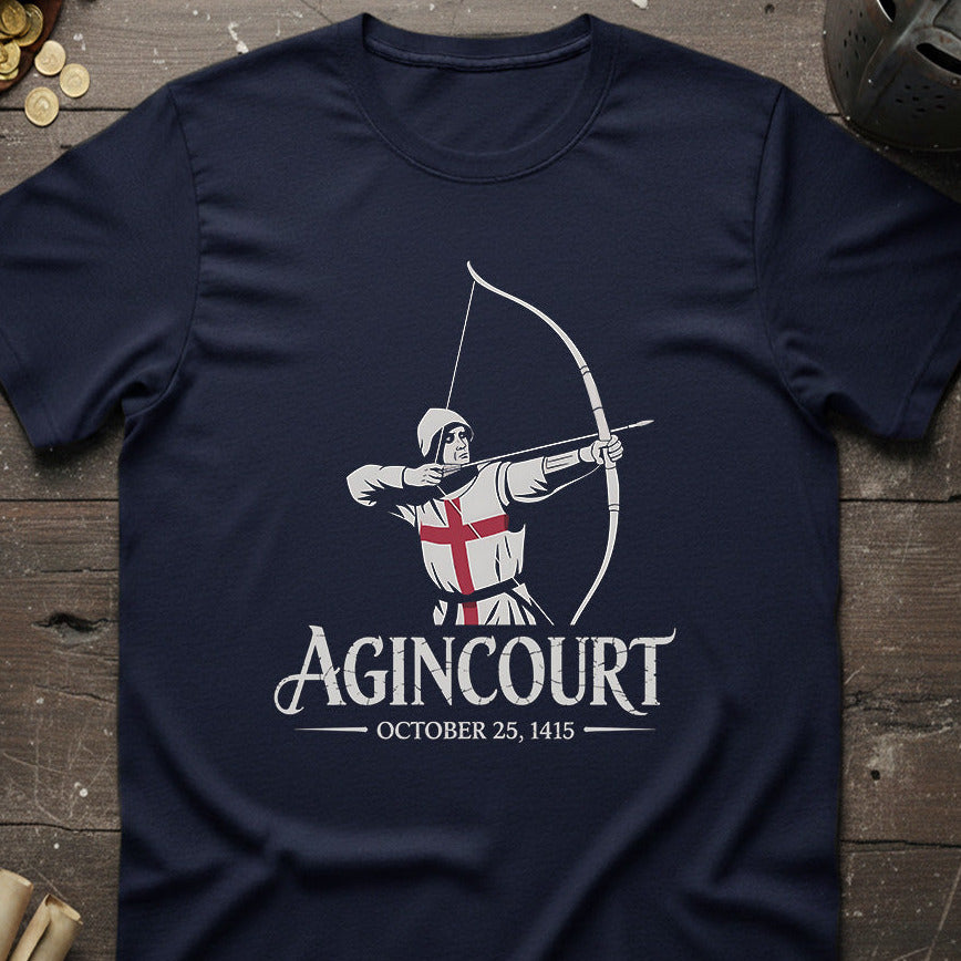 Navy blue t-shirt with 'Agincourt' design featuring a warrior and English flag on a wooden surface.