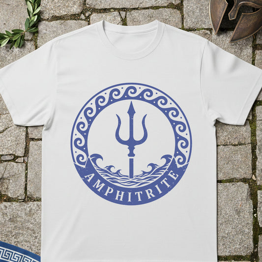White t-shirt with blue 'Amphitrite' design on a stone surface