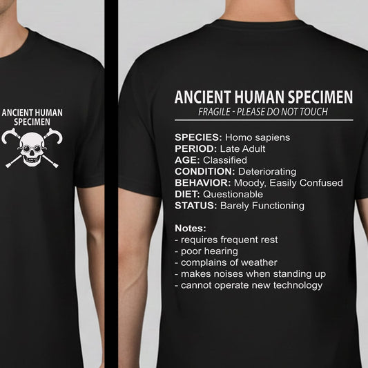 Black short-sleeve T-shirt shown from both front and back on a cropped male model. The front has a white skull-and-crossbones graphic with the text 'ANCIENT HUMAN SPECIMEN.