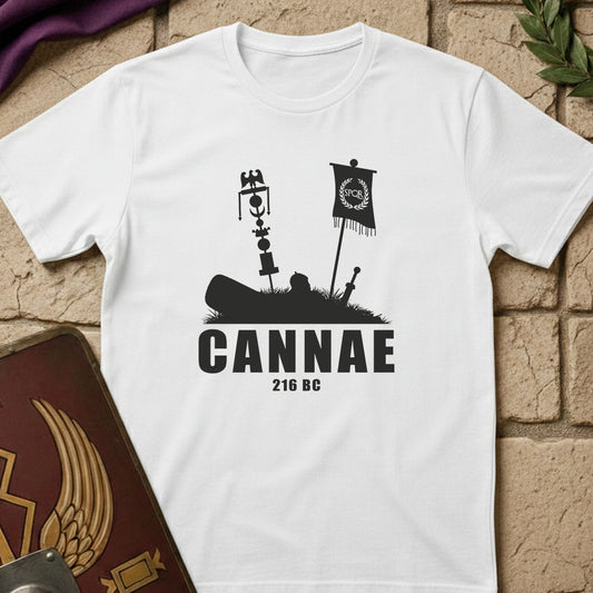White t-shirt with black graphic design and 'Cannae 216 BC' text on a stone surface.
