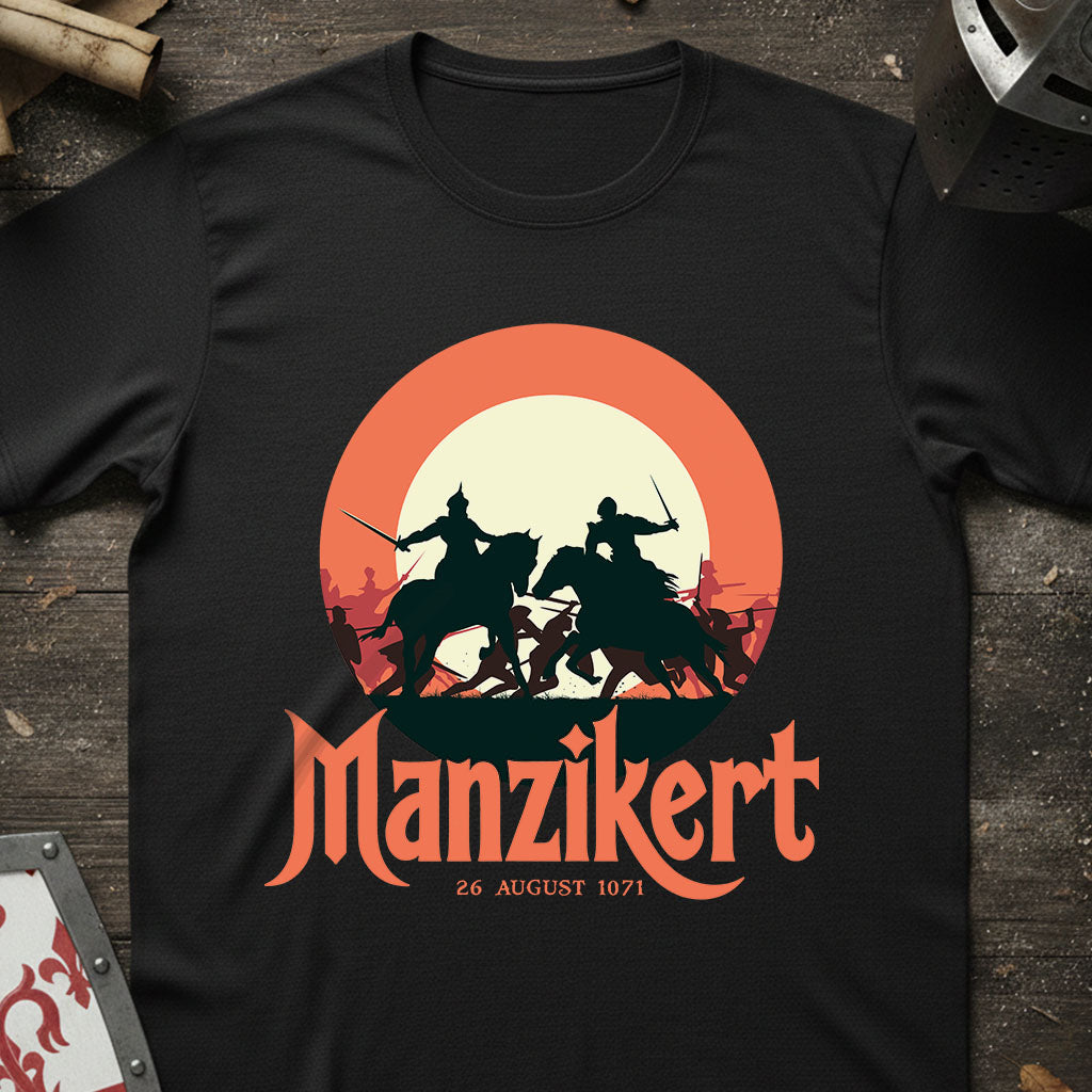 Black t-shirt with 'Manzikert' graphic design featuring warriors on horses against a sunset background.