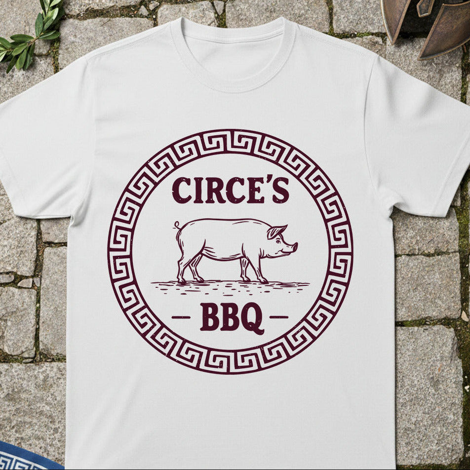 White t-shirt with 'Circe's BBQ' graphic on a stone surface
