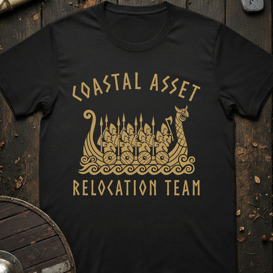 Black t-shirt with gold graphic and text 'Coastal Asset Relocation Team' on a wooden background