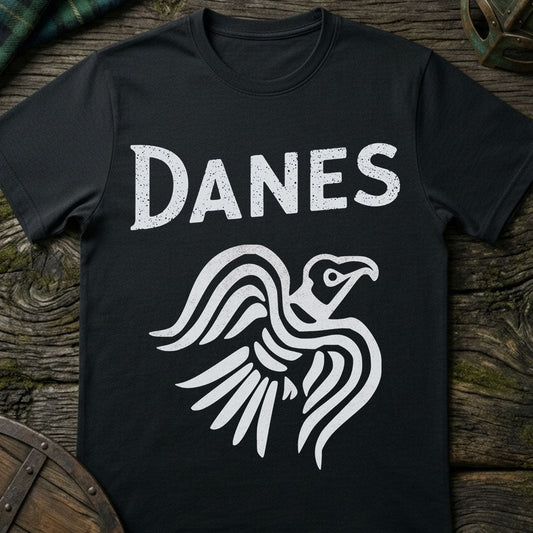Black t-shirt with 'Danes' and an raven design on a wooden surface