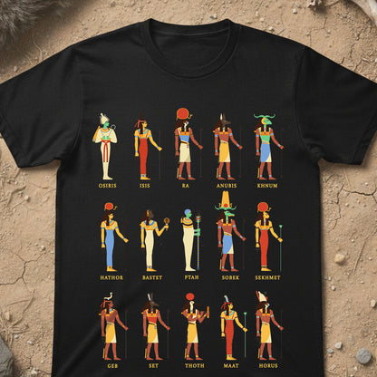 Black t-shirt with colorful Egyptian deities illustrations and names on a textured beige background