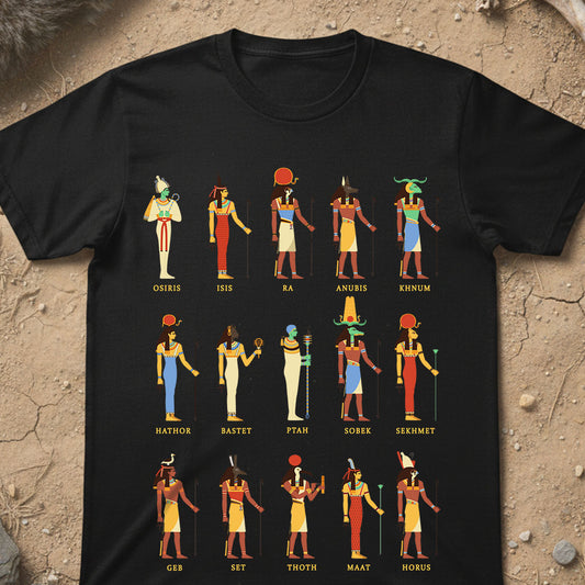 Black t-shirt with colorful Egyptian deities illustrations and names on a textured beige background