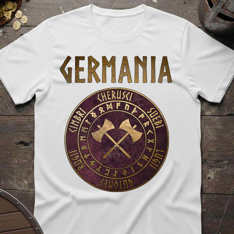 White t-shirt with 'GERMANIA' design featuring crossed axes and runes on a wooden surface.