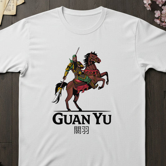 White t-shirt with Guan Yu graphic and text on a wooden surface