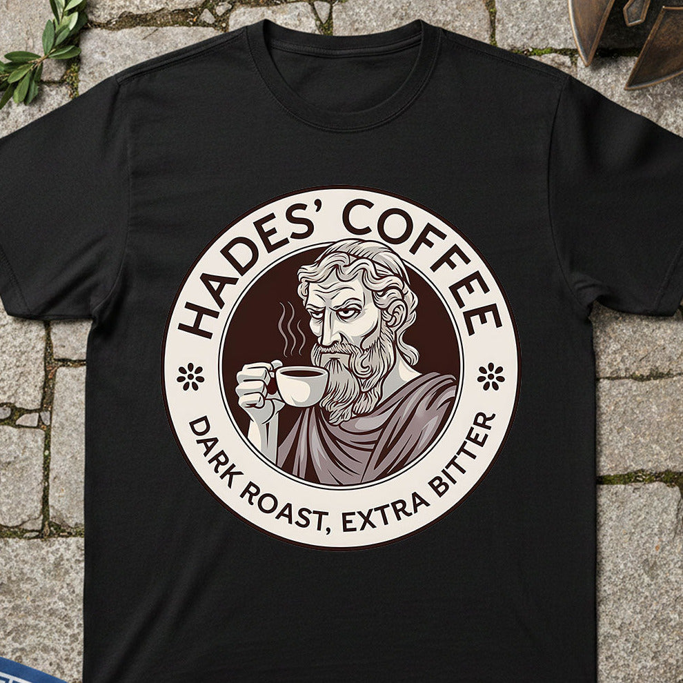 Black t-shirt with 'Hades' Coffee' graphic on a stone surface