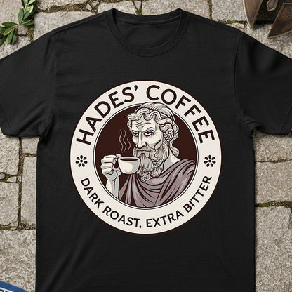 Black t-shirt with 'Hades' Coffee' graphic on a stone surface