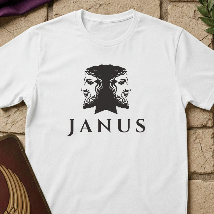 White t-shirt with 'Janus' graphic design on a textured surface