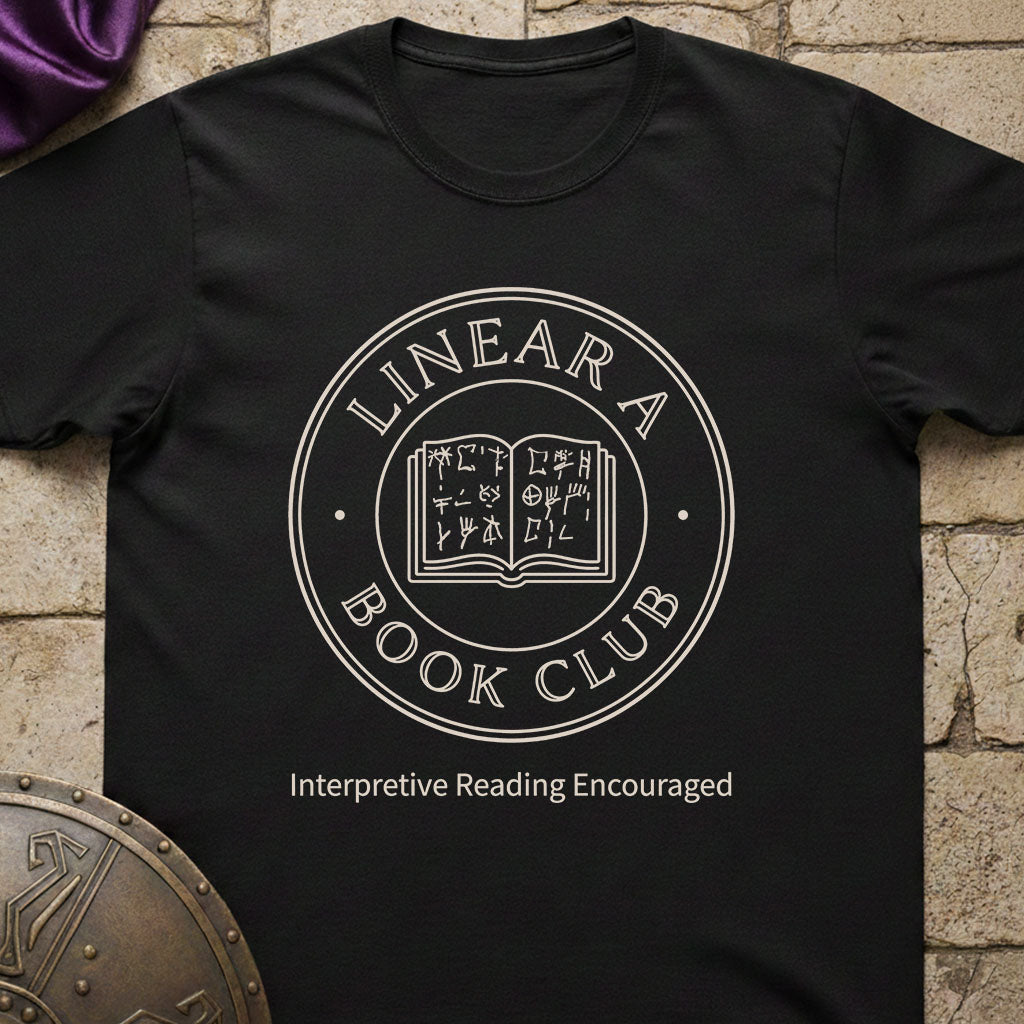 Black t-shirt with 'Linear A Book Club' design on a stone surface
