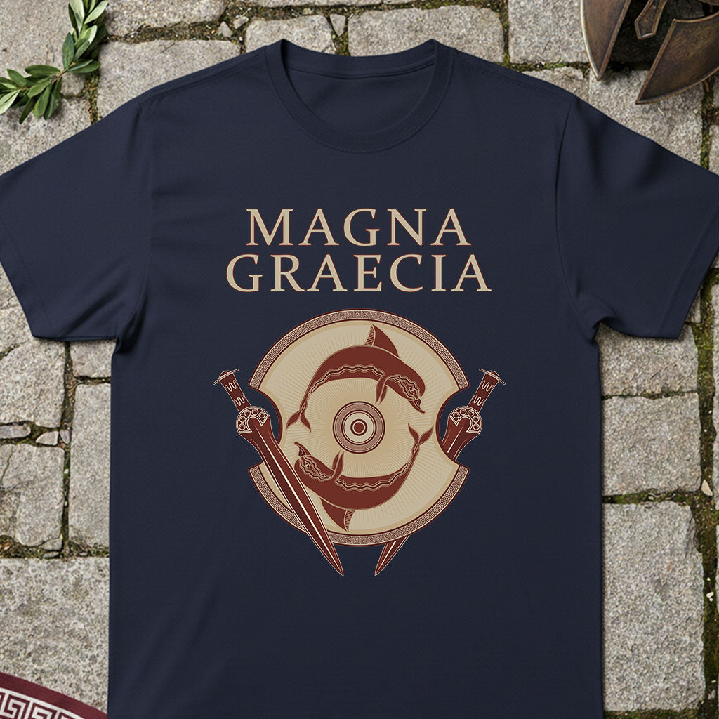 Navy blue t-shirt with 'Magna Graecia' design on a stone surface