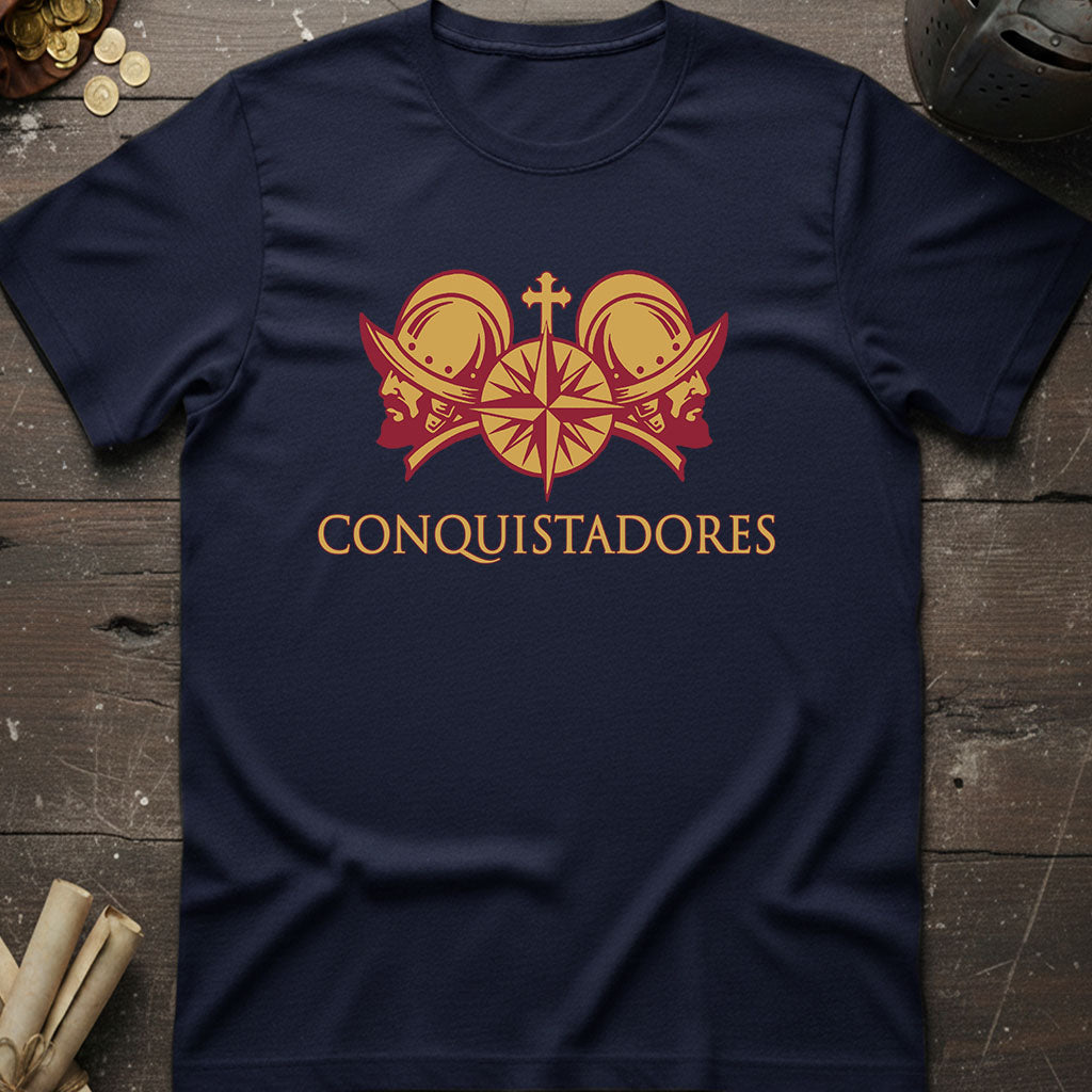 Navy blue t-shirt with 'Conquistadores' design on a wooden surface.