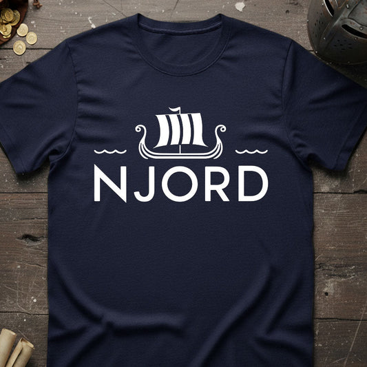 Navy blue t-shirt with 'NJORD' and a ship design on a wooden surface.