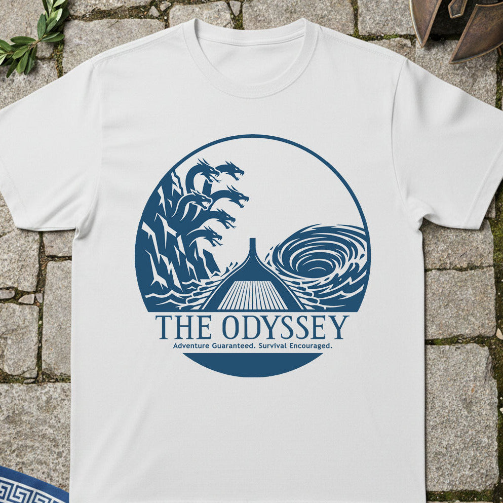 White t-shirt with 'The Odyssey' graphic design on a stone surface