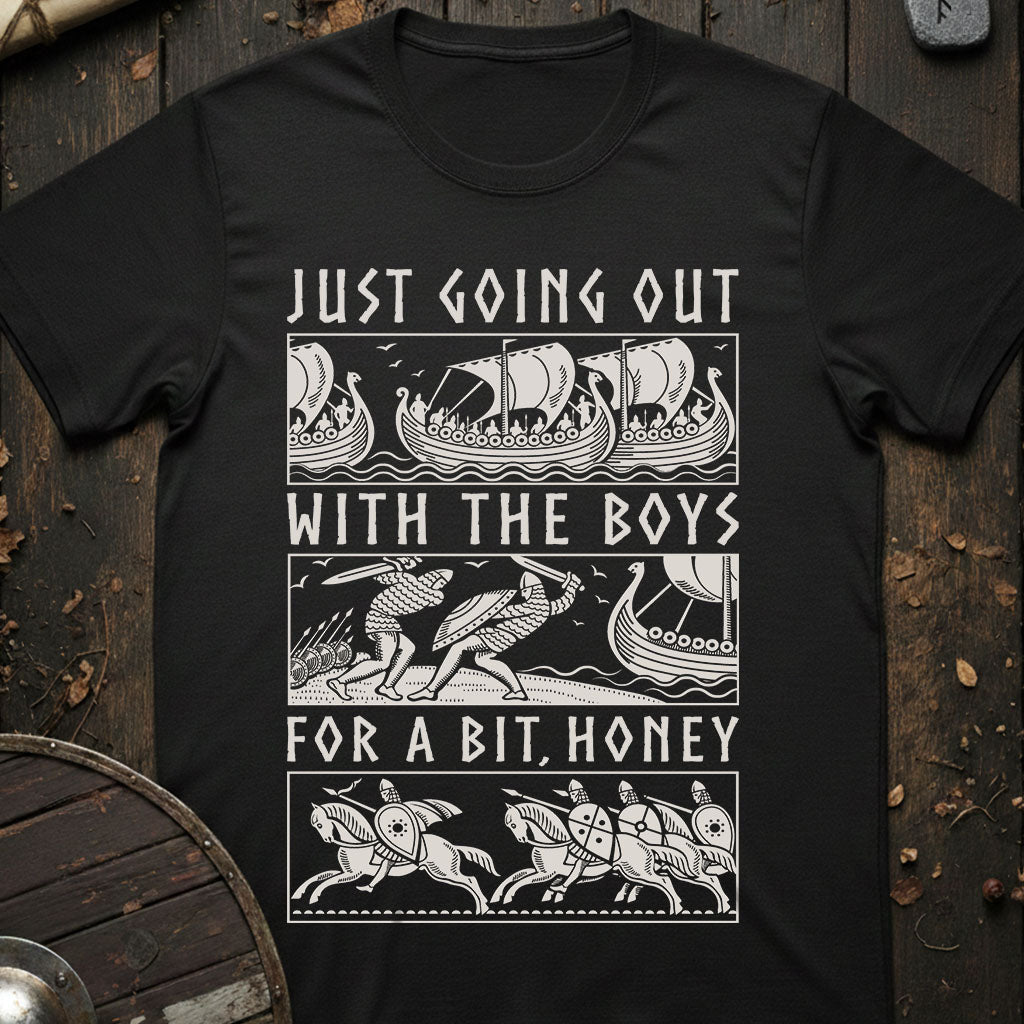 Black t-shirt with Viking-themed graphic and text on a wooden background