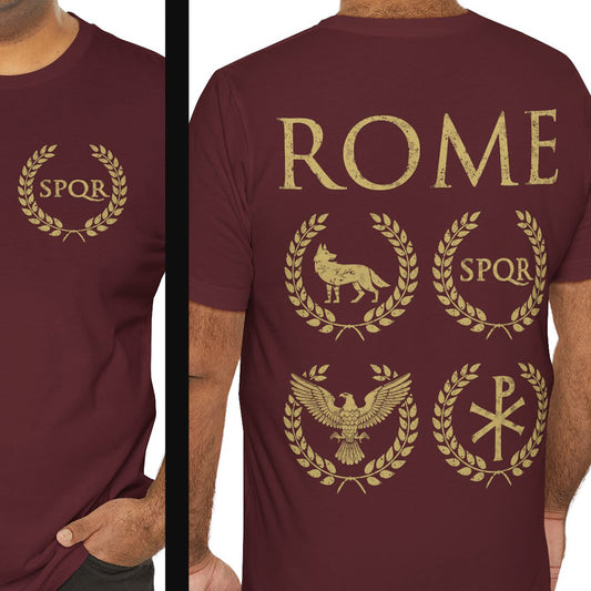 Maroon t-shirt with gold Roman-themed designs on a person wearing it.