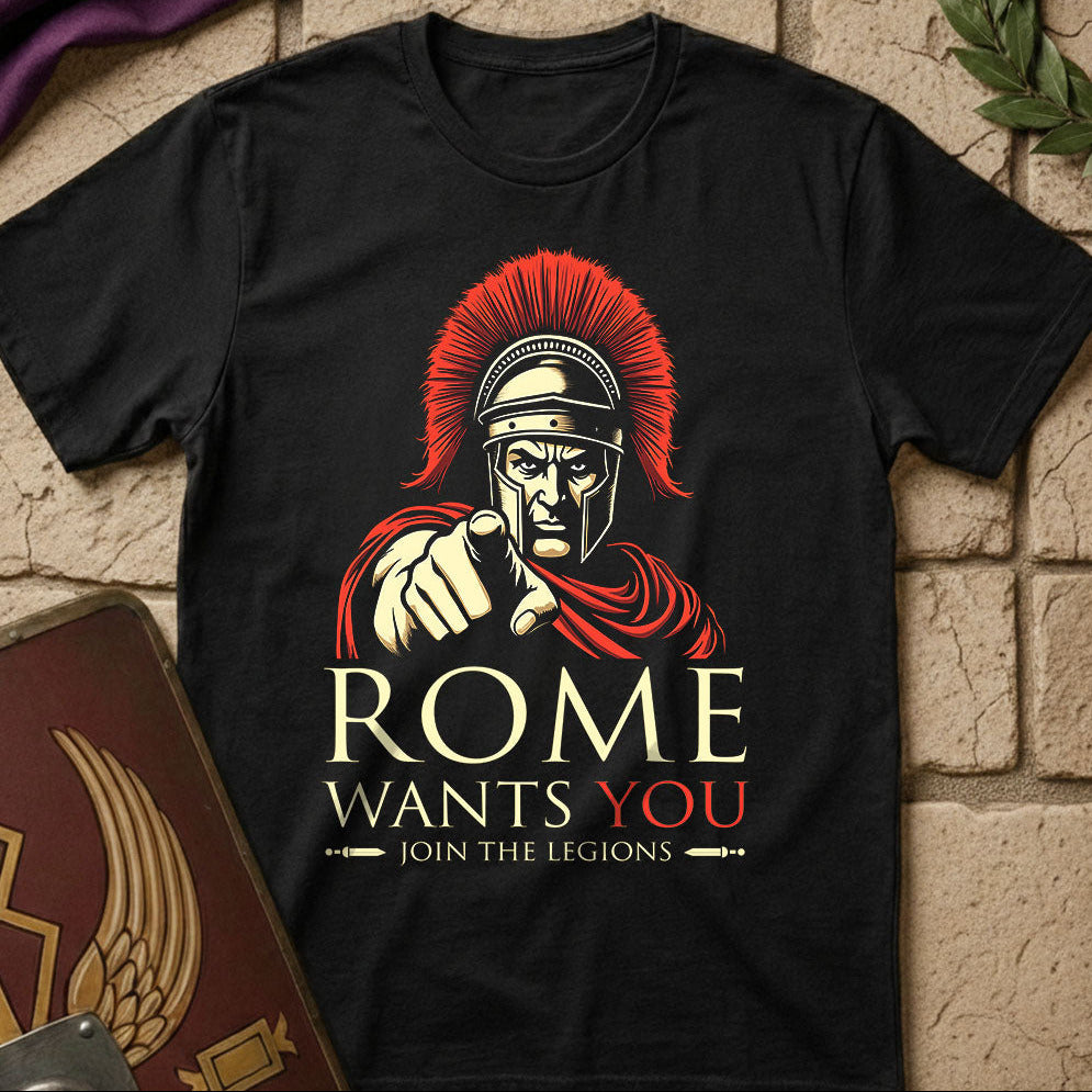 Black t-shirt with Roman warrior graphic and 'Rome Wants You' text on a stone surface.