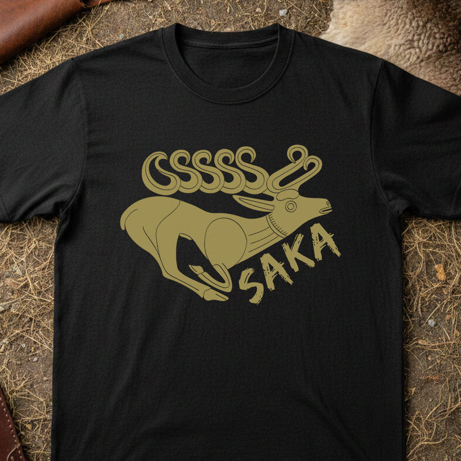 Saka Tribe Black t-shirt with gold graphic design on a textured surface