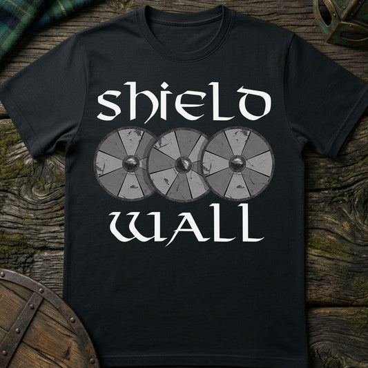 Black t-shirt with 'shield wall' design on a wooden surface