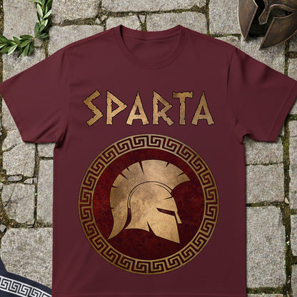 Maroon t-shirt with 'Sparta' design on a stone surface
