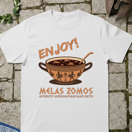White t-shirt with a graphic design of Spartan Melas Zomos  and text on a stone surface
