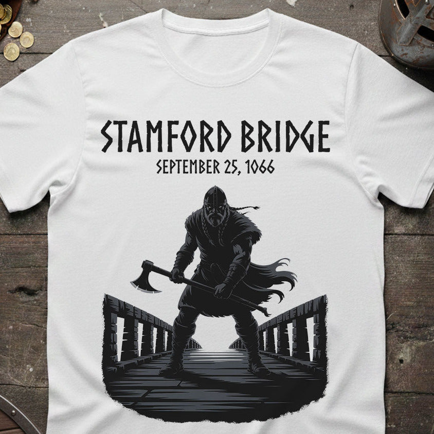 Battle of Stamford Bridge White t-shirt with a Viking design and text on a wooden surface