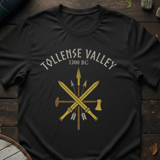 Black t-shirt with 'Tollense Valley 1300 BC' design on a wooden surface
