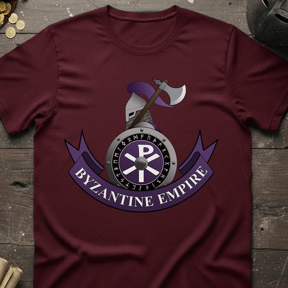 Maroon t-shirt with Byzantine Empire design on a wooden surface