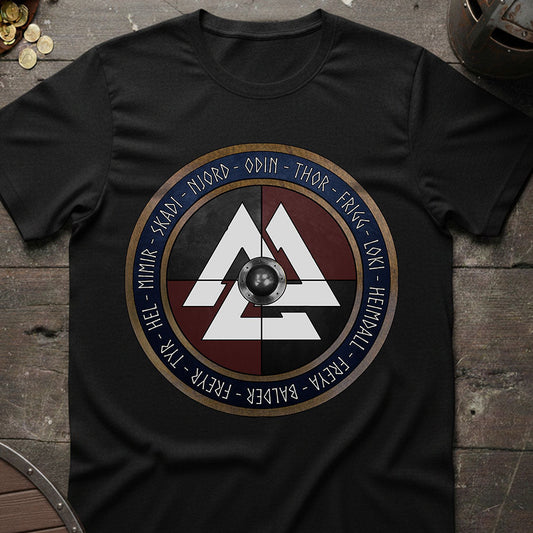 Black t-shirt with a Viking design on a wooden surface