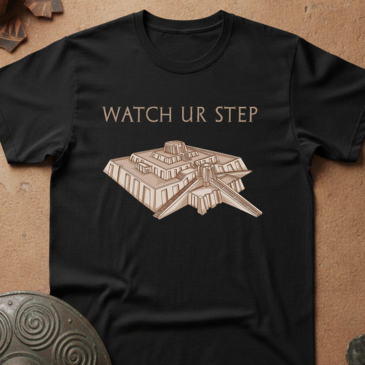 Black t-shirt with 'Watch Ur Step' and Ziggurat of UR Sumerian graphic design on a textured surface