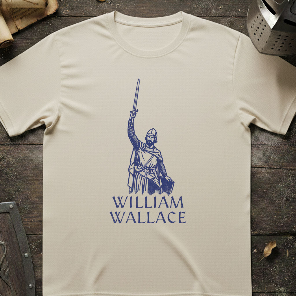 An off-white t-shirt laid flat on a dark wooden surface, featuring a blue graphic of a knight holding a sword with the text 'WILLIAM WALLACE' underneath.