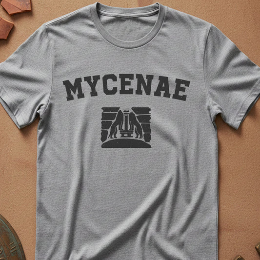Gray t-shirt with 'MYCENAE' text and logo on a brown surface
